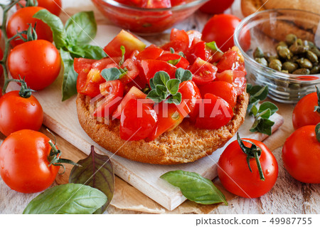 Frisella seasoned with tomatoes and herbs Frisella seasoned with tomatoes and herbs 49987755