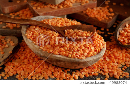 Red lentils in a bowl with a spoon Red lentils in a bowl with a spoon 49988074