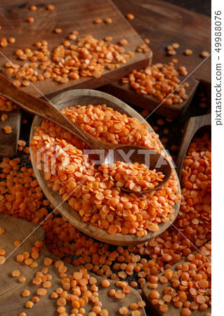 Red lentils in a bowl with a spoon Red lentils in a bowl with a spoon 49988076