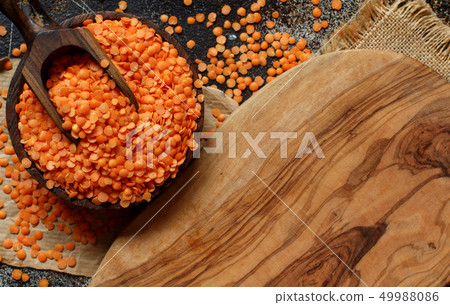 Red lentils in a bowl with a spoon Red lentils in a bowl with a spoon 49988086