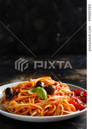 Spaghetti with tomato sauce olives and capers Spaghetti with tomato sauce olives and capers 49988368