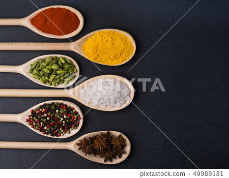 Big set of Indian spices on a black background Big set of Indian spices on a black background 49989181