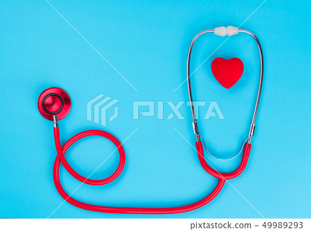 Red heart and stethoscope on on blue background. Red heart and stethoscope on on blue background. 49989293