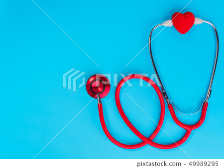 Red heart and stethoscope on on blue background. Red heart and stethoscope on on blue background. 49989295
