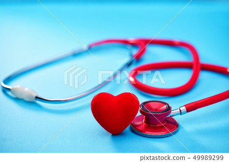 Red heart and stethoscope on on blue Red heart and stethoscope on on blue 49989299