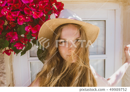 Portrait of smiling girl with tangled hair  49989752