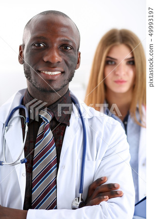 Group of smiling friendly medicine doctors look in camera 49993197