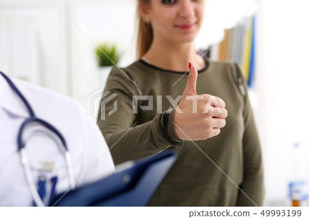 Female patient showing OK or approval sign 49993199