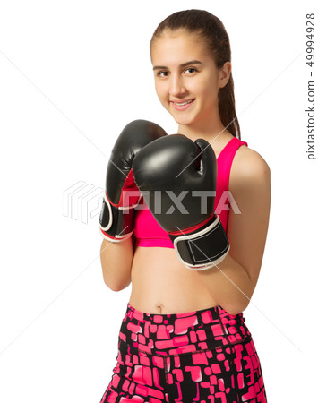 Young girl kickboxer isolated Young girl kickboxer isolated 49994928