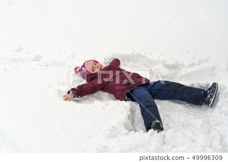 Little girl in winter outdoors 49996309