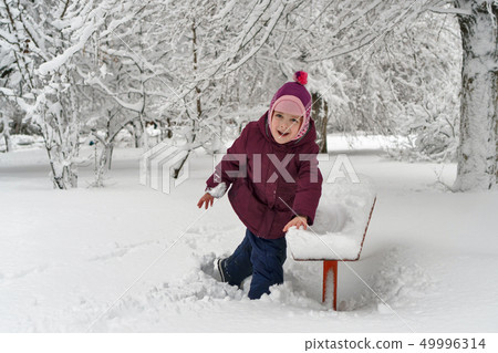 Little girl in winter outdoors 49996314