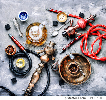Hookah smoking with tea Hookah smoking with tea 49997100