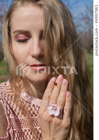 insect Ladybird women's hand in the spring in the garden insect Ladybird women's hand in the spring in the garden 49997961