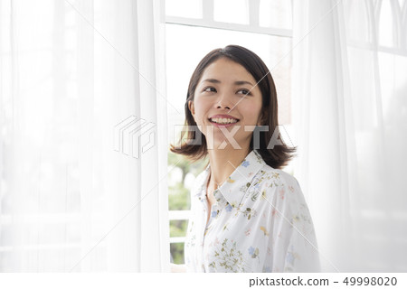 Young woman lifestyle turning around beauty veranda Young woman lifestyle turning around beauty veranda 49998020