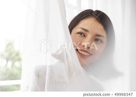 Young woman lifestyle beauty curtain Young woman lifestyle beauty curtain 49998347