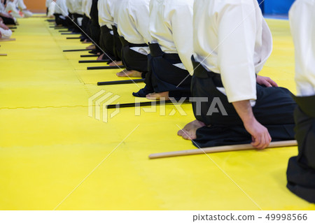 People in kimono on martial arts weapon training seminar People in kimono on martial arts weapon training seminar 49998566