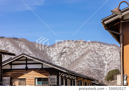 The snowy mountains and the cityscape of World Heritage Shirakawago The snowy mountains and the cityscape of World Heritage Shirakawago 50002017