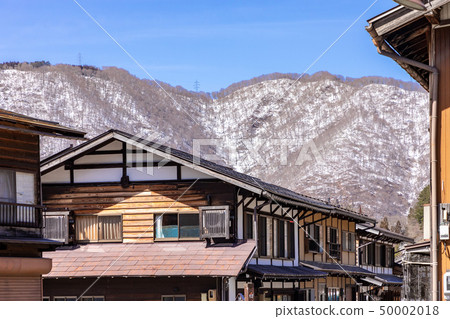 The snowy mountains and the cityscape of World Heritage Shirakawago The snowy mountains and the cityscape of World Heritage Shirakawago 50002018