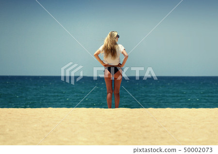 Sexy shape beautiful Blond beach sand sky butt sea 50002073