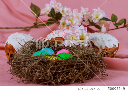 Easter eggs in Easter cake basket with colorful 50002249