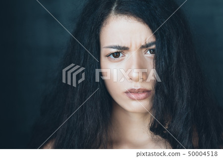 young woman worried concerned fear anxiety young woman worried concerned fear anxiety 50004518