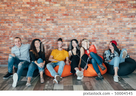 millennials chilling out leisure zone laughing 50004545