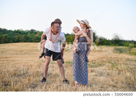 Happy young family. A father, a pregnant mother, Happy young family. A father, a pregnant mother, 50004600