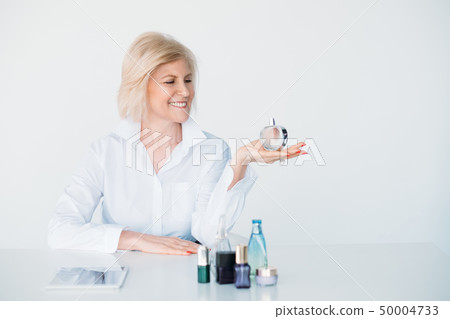smiling stylish aged lady lifestyle perfume choice smiling stylish aged lady lifestyle perfume choice 50004733