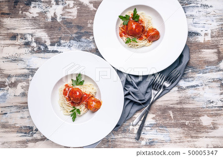 Top view meatballs in tomato sauce with basil Top view meatballs in tomato sauce with basil 50005347