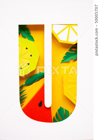letter u cut from paper with tropical fruit paper 50005707
