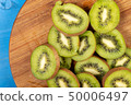 Kiwi Fruit On The Cutting Wooden Board 50006497