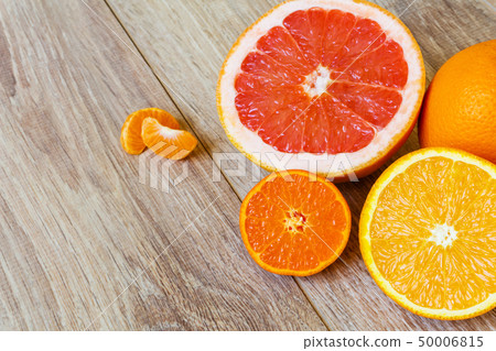 various citrus fruits on wooden table various citrus fruits on wooden table 50006815