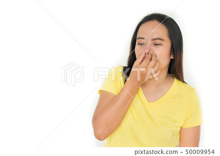 woman holding her nose because of bad smell 50009954