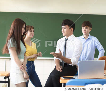 teacher with group of college students in 50013031