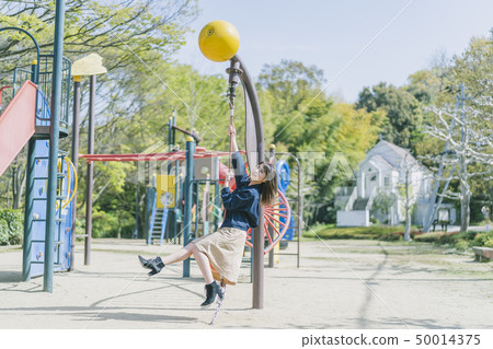 Women playing in the park Women playing in the park 50014375