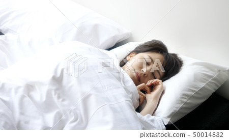 A woman sleeping A woman sleeping 50014882