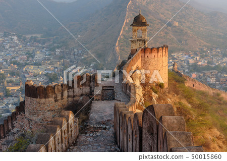 Ancient long wall with towers around Amber Fort 50015860