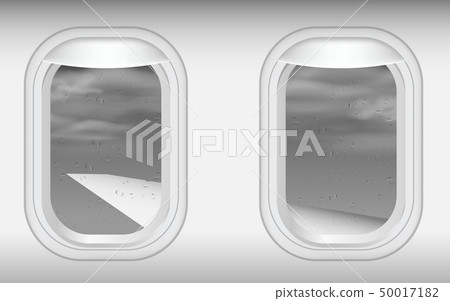 view of windows of plane in on the sky in the rain 50017182