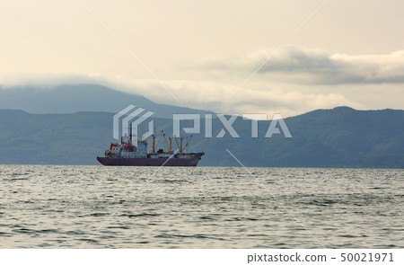 fishing boat in gray morning on Pacific ocean off 50021971