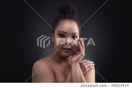 Beautiful black african woman face studio portrait. 50023914