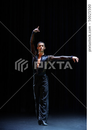female muscular ballroom dancer making pose isolated on black 50025500