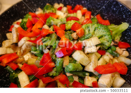 Vegetables cooked in a pan. Mushrooms champignons, Vegetables cooked in a pan. Mushrooms champignons, 50033511