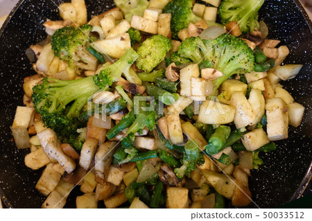 Vegetables cooked in a pan. Mushrooms champignons, Vegetables cooked in a pan. Mushrooms champignons, 50033512