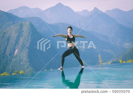 woman practice yoga Warrior I or Virabhadrasana woman practice yoga Warrior I or Virabhadrasana 50035070