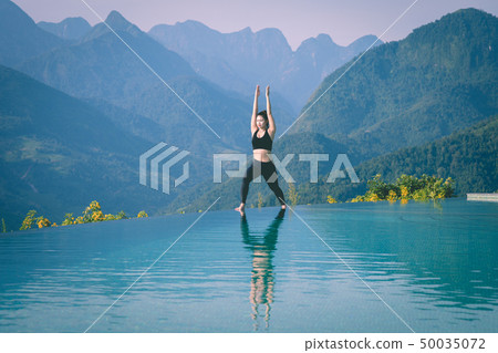 woman practice yoga Warrior I or Virabhadrasana woman practice yoga Warrior I or Virabhadrasana 50035072