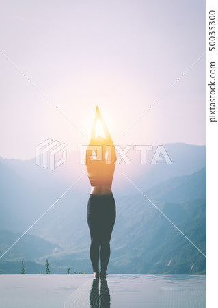 woman practice yoga Surya Namaskar 50035300