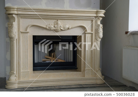 Stylish fireplace with fire in home interior Stylish fireplace with fire in home interior 50036028