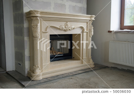 Stylish fireplace with fire in home interior Stylish fireplace with fire in home interior 50036030