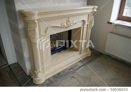 Stylish fireplace with fire in home interior Stylish fireplace with fire in home interior 50036033