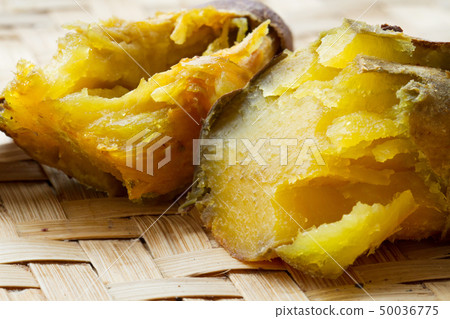 roasted Japanese sweet potato on weave wood tray roasted Japanese sweet potato on weave wood tray 50036775